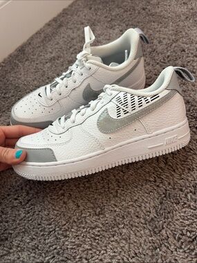 Nike White Low-Top Air Force One Sneakers with Silver Swoosh